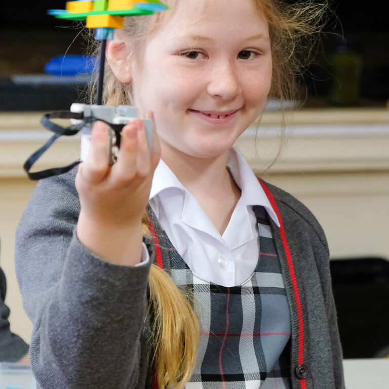 girl holding lego