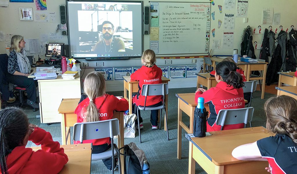 children watching a video in class