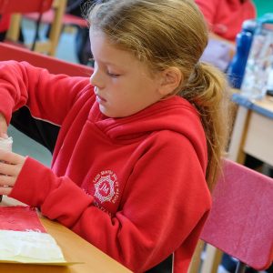 child using a glue stick