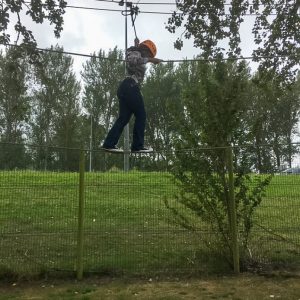 child on a rope bridge