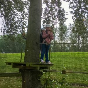 children attempting a zip wire