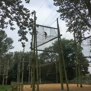 child climbing rope ladder