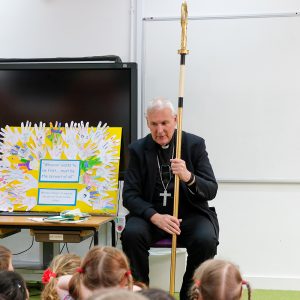 Bishop holding a stick