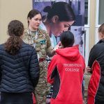 Army support staff talk to students