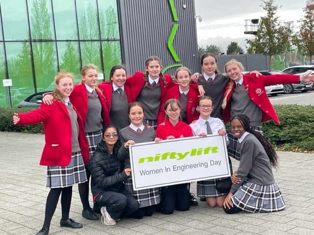 Students holding a nifty lift sign