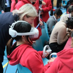 children wearing VR headsets