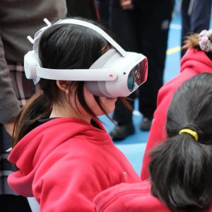 children wearing VR headsets