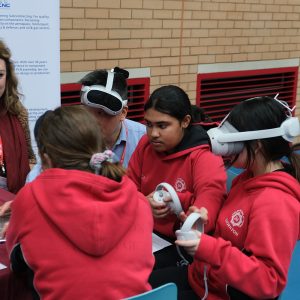 children wearing VR headsets