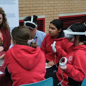 children wearing VR headsets