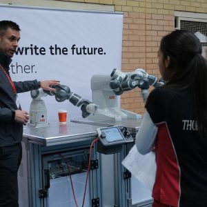man holding a robot