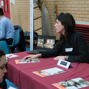 Person talking to students