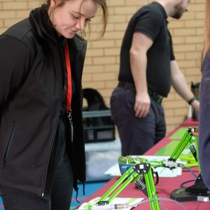 lady in front of an invention