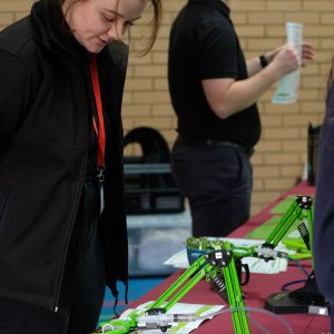 lady standing in front of a machine