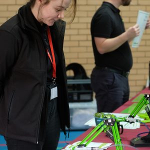 girl standing in front of an invention