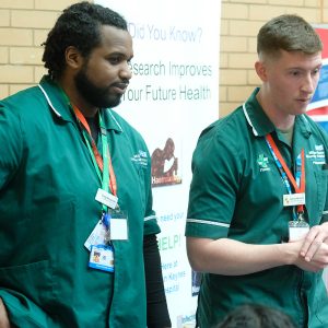 2 nurses talking to students