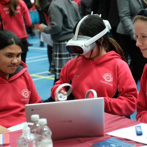 students using a headset and a laptop