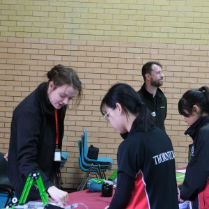 students talking to a member of staff