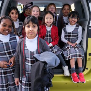 girls sat in a car