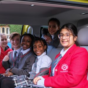 girls sat in a car