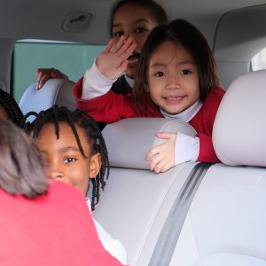 girls sat in a car