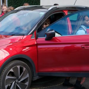 girls testing out a car