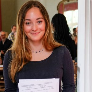 girl holding her exam results