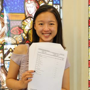 girl holding her exam results