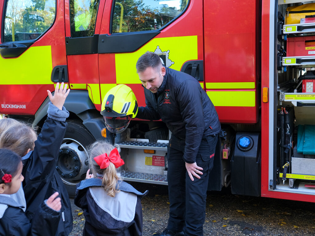 fireman with little students