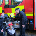 fireman with little students