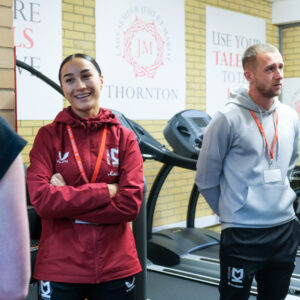 MK Dons Players In New Gym Talking With Sports Scholar Students