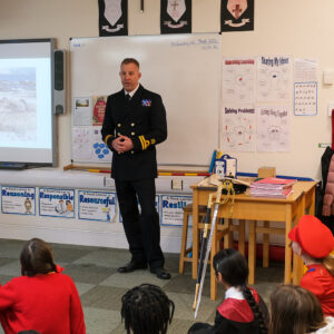 Man delivering a speech to a class