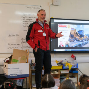 Man delivering a speech to a class