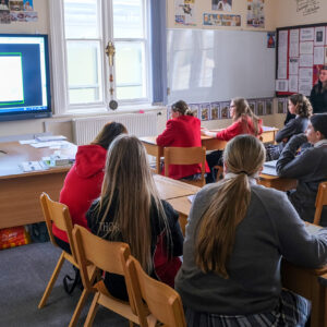 students looking at a screen in class