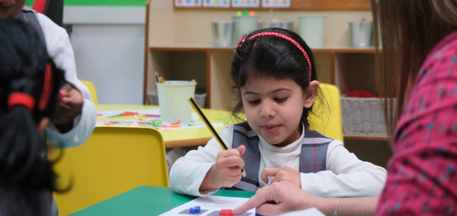 girl using a pencil