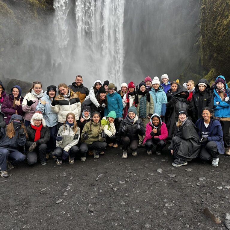 children in front a waterfall
