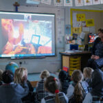 students watching a video in class