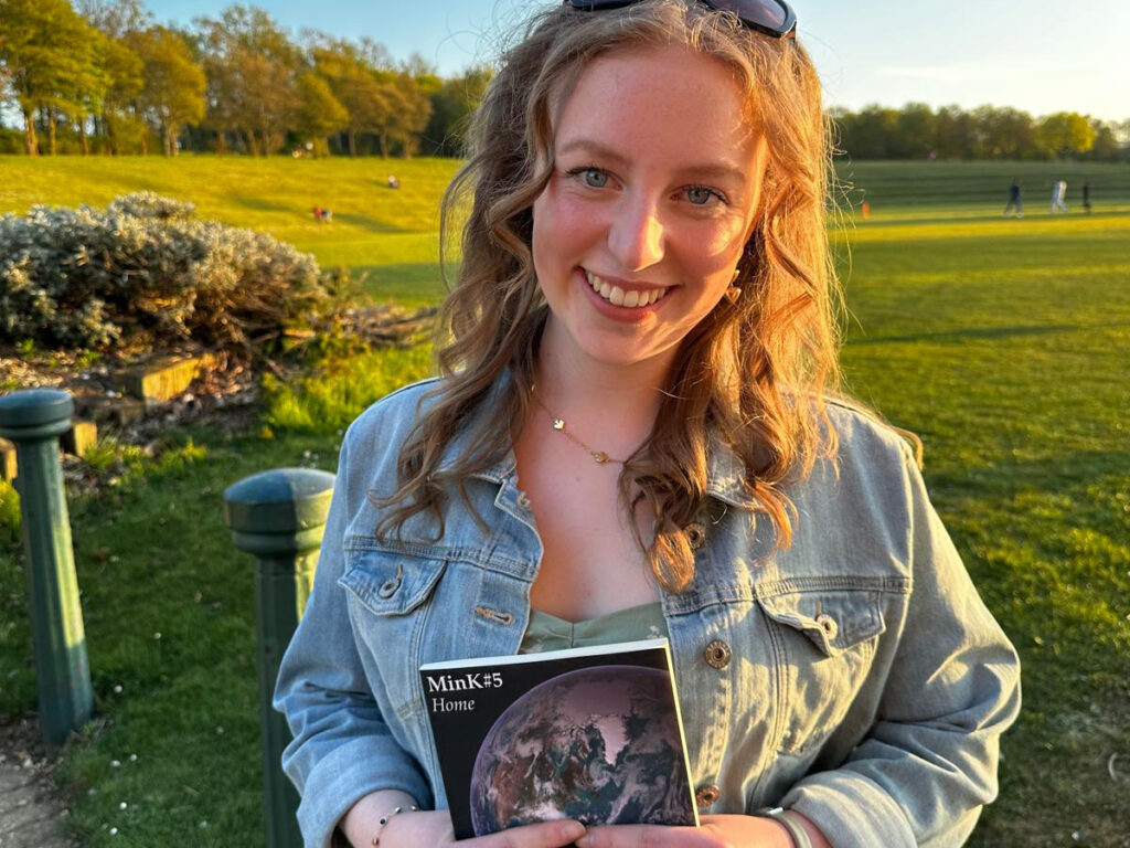 smiling girl holding a book