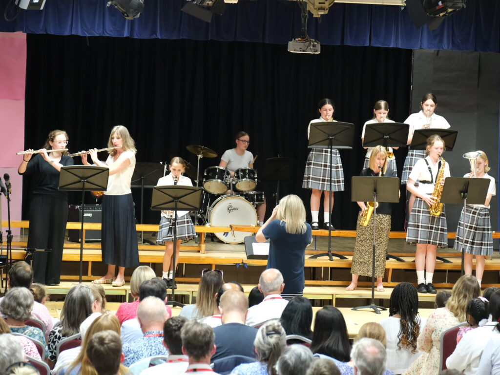 Group of students and teachers performing wind instruments