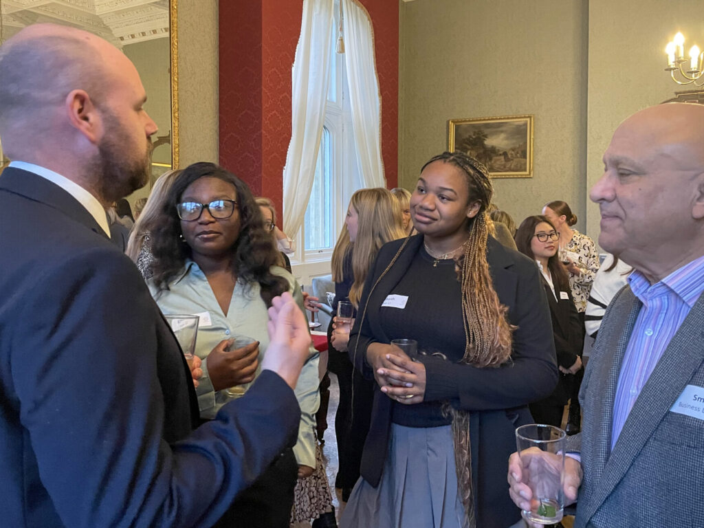students and teachers at a networking event