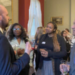 students and teachers at a networking event